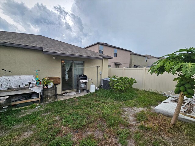 view of yard with a patio area and central AC