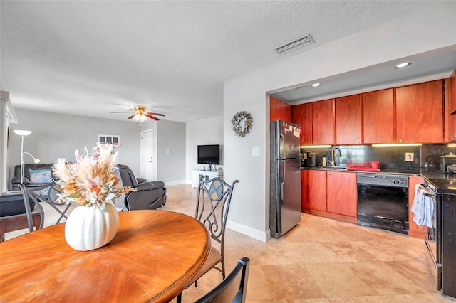 kitchen with a textured ceiling, tasteful backsplash, sink, black appliances, and ceiling fan