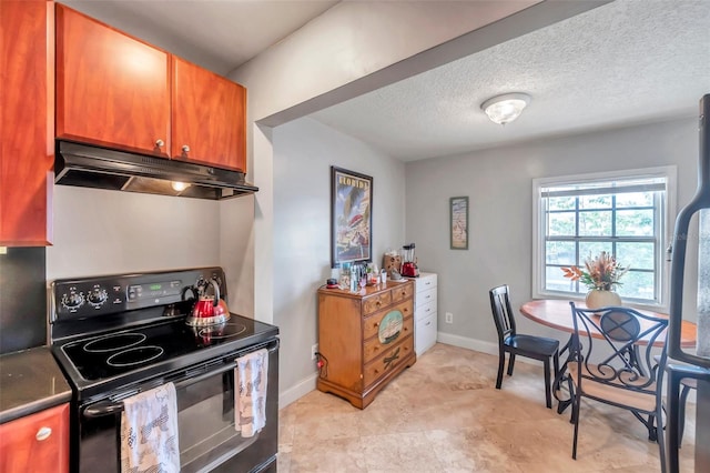 kitchen with a textured ceiling and black electric range oven