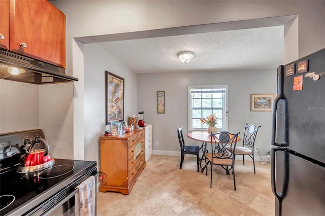 dining room featuring a textured ceiling