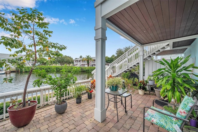 view of patio / terrace with a water view