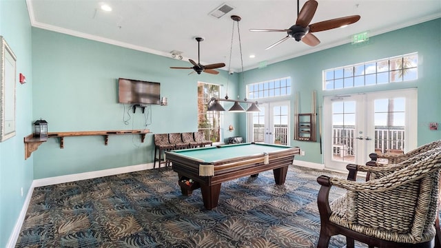 recreation room featuring french doors, billiards, ornamental molding, and a healthy amount of sunlight