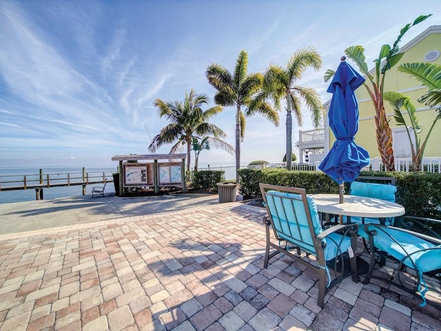 view of patio with a water view