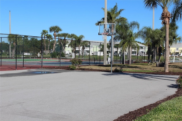 view of basketball court featuring tennis court