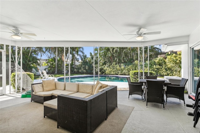 sunroom featuring plenty of natural light and ceiling fan