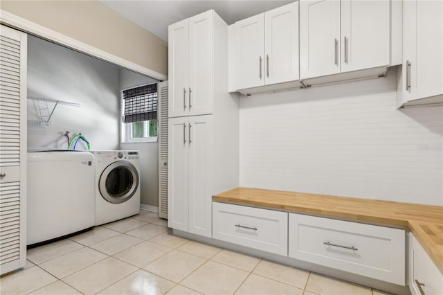 washroom featuring light tile patterned floors and washer / dryer