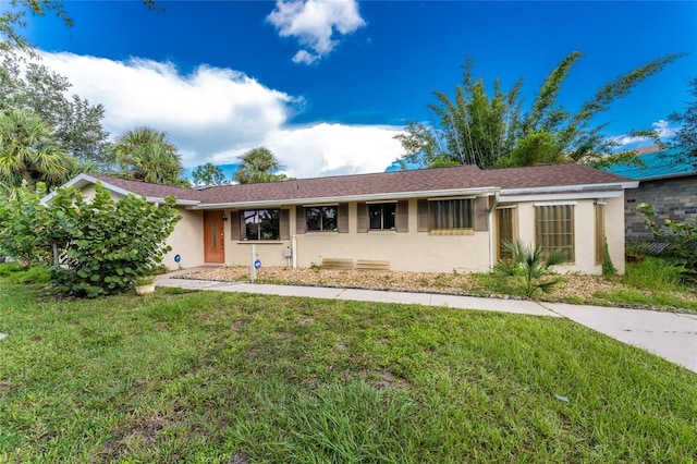 ranch-style home with a front yard