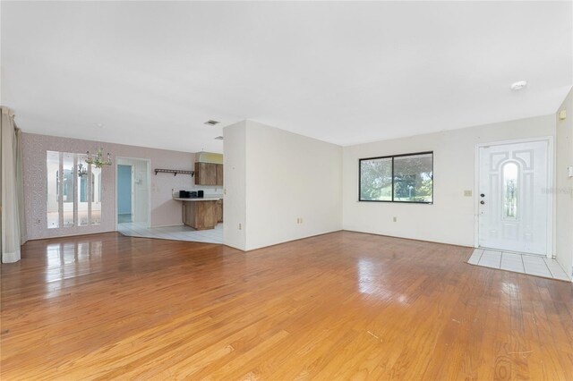 unfurnished living room featuring light wood-type flooring