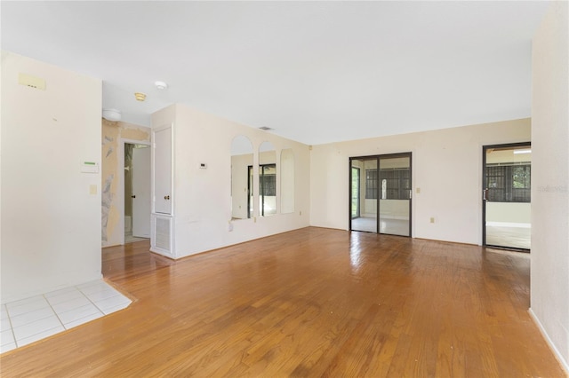 spare room with light hardwood / wood-style flooring