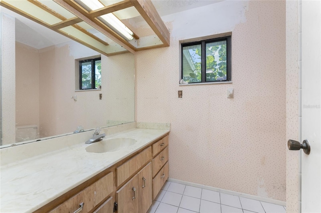 bathroom featuring tile patterned flooring and vanity