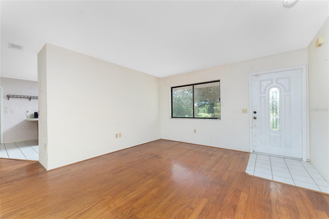 foyer entrance with light hardwood / wood-style flooring