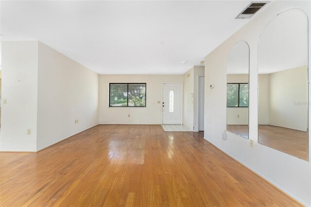 unfurnished living room featuring light hardwood / wood-style flooring