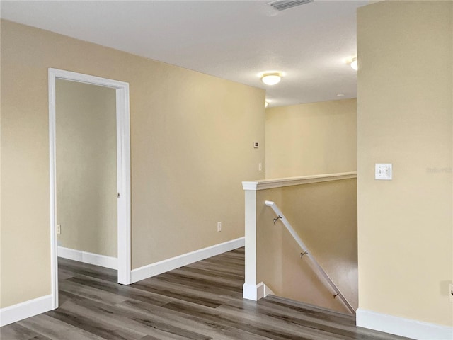 empty room featuring dark wood-type flooring