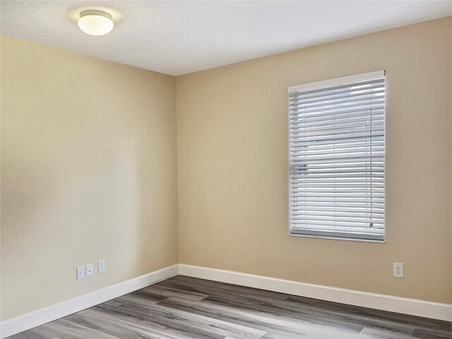 spare room featuring hardwood / wood-style floors