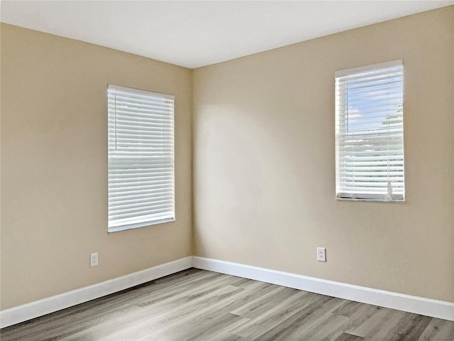 empty room with light hardwood / wood-style floors