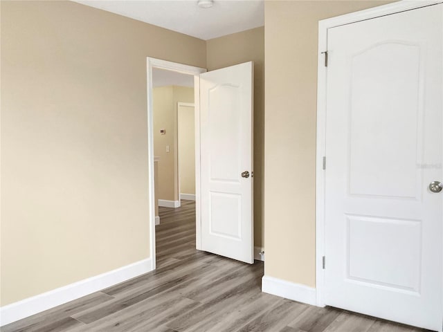 unfurnished bedroom featuring hardwood / wood-style floors