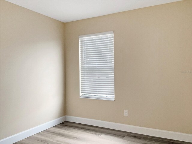 spare room featuring light wood-type flooring