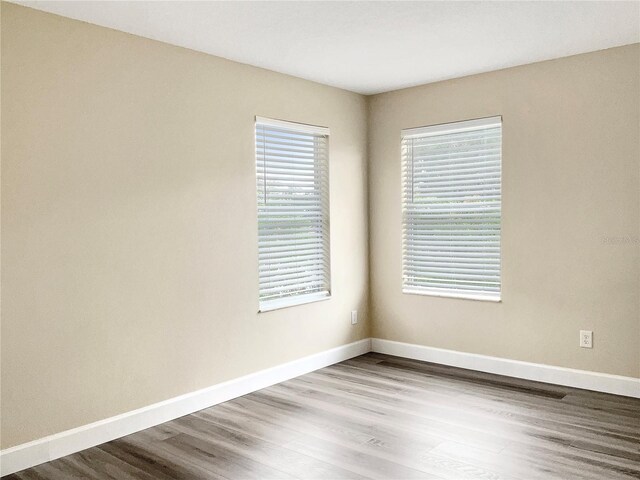 empty room with light hardwood / wood-style floors