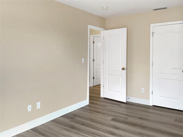 interior space with dark hardwood / wood-style floors