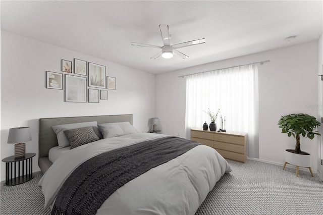 bedroom with light carpet and ceiling fan