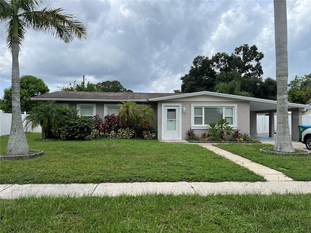 ranch-style house featuring a front lawn