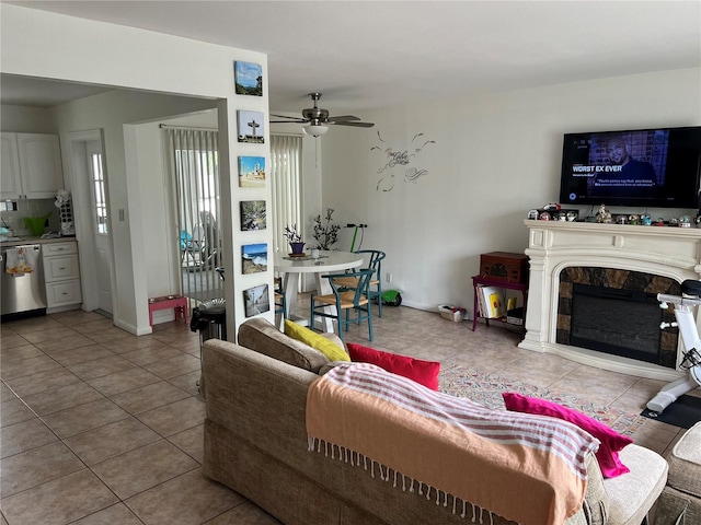 tiled living room featuring ceiling fan