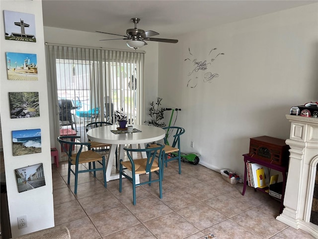 dining room with ceiling fan and light tile patterned floors