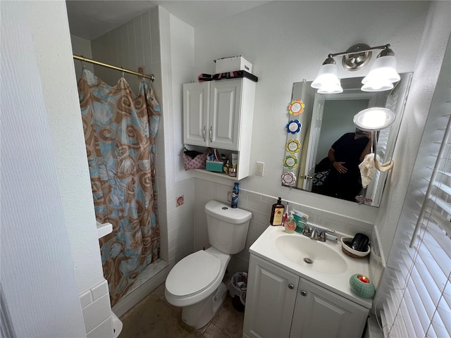 bathroom featuring vanity, curtained shower, tile walls, toilet, and tile patterned floors