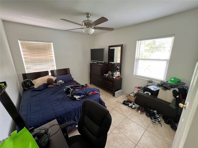 bedroom with light tile patterned flooring and ceiling fan