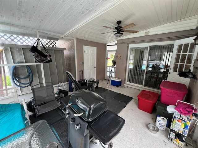 sunroom with ceiling fan and wood ceiling