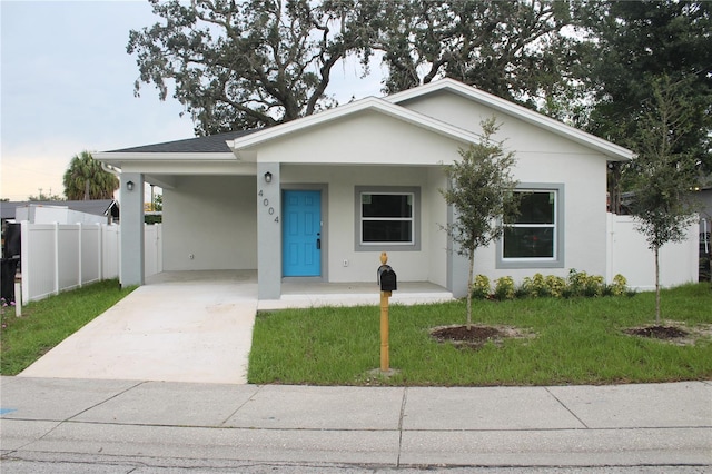 view of front of home featuring a carport