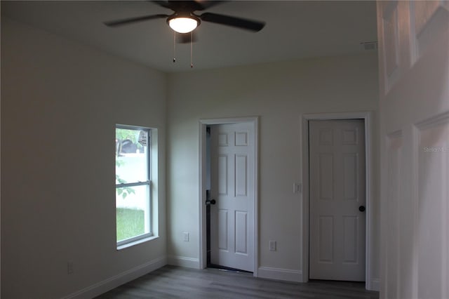 empty room with ceiling fan and light wood-type flooring