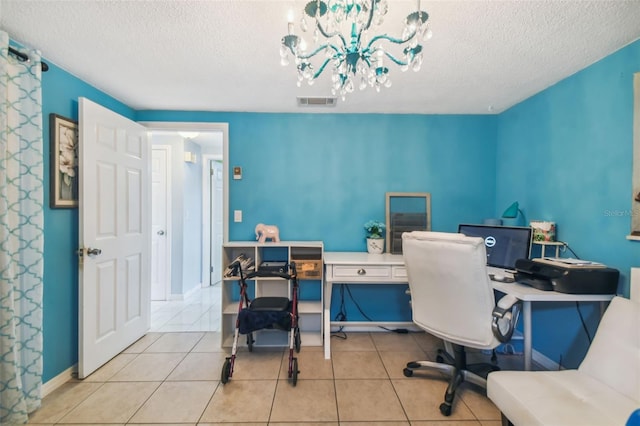 home office featuring light tile patterned flooring, a textured ceiling, and an inviting chandelier