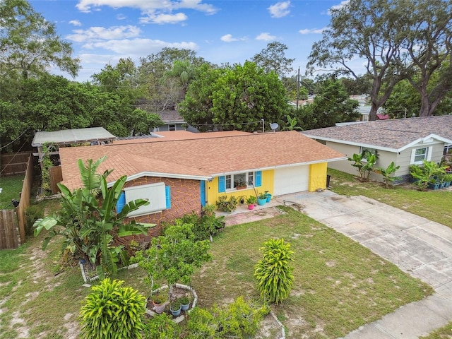 view of front facade with a front yard and a garage