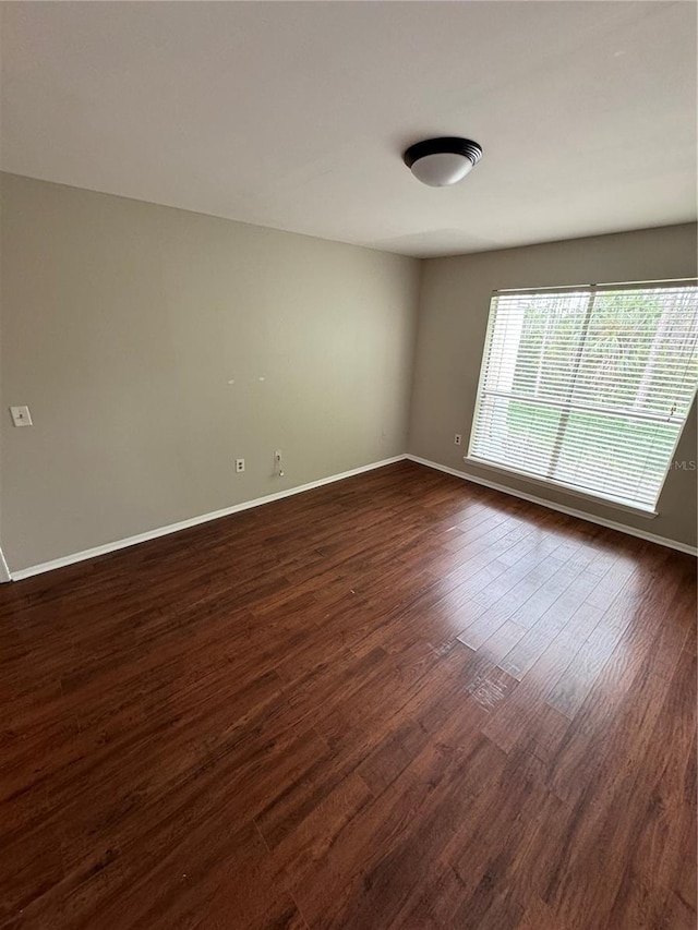 unfurnished room featuring dark hardwood / wood-style floors