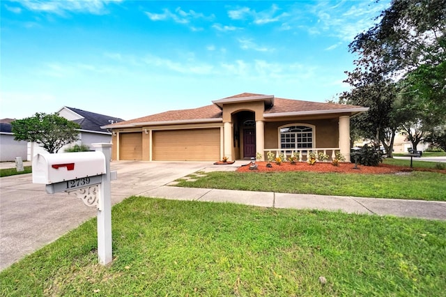 12739 Standbridge Dr, Riverview, FL 33579 - ranch-style house featuring stucco siding, a garage, driveway, a front lawn, and a shingled roof