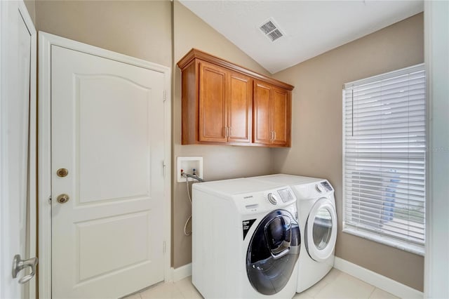 12739 Standbridge Dr, Riverview, FL 33579 - washroom featuring cabinet space, washer and dryer, light tile patterned floors, and baseboards