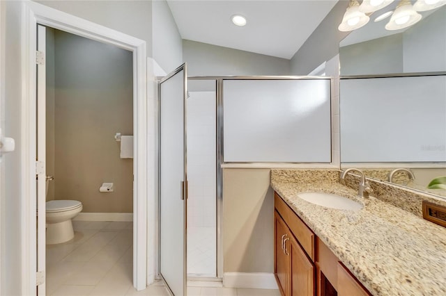 bathroom with lofted ceiling, walk in shower, vanity, and toilet