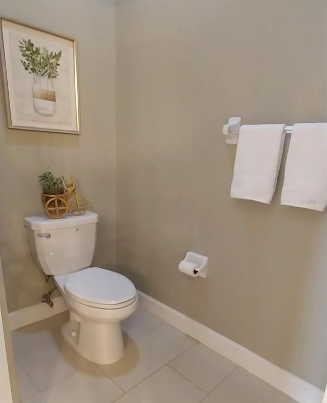 bathroom with tile patterned flooring and toilet