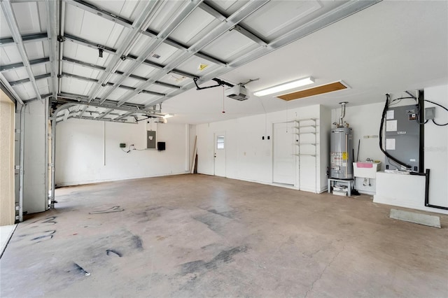 garage featuring gas water heater, a garage door opener, and electric panel