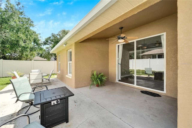 view of patio / terrace featuring ceiling fan