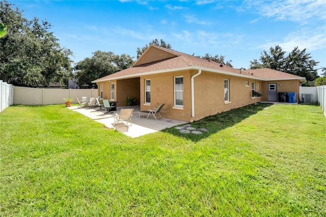 12739 Standbridge Dr, Riverview, FL 33579 - rear view of house with stucco siding, central air condition unit, and a patio area