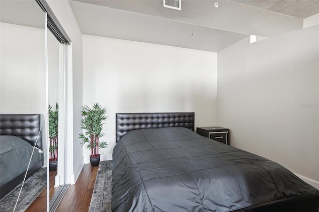 bedroom featuring dark wood-type flooring