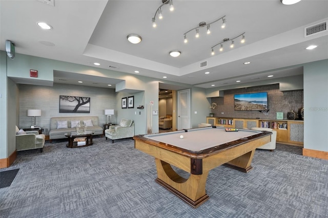 game room featuring pool table and a tray ceiling