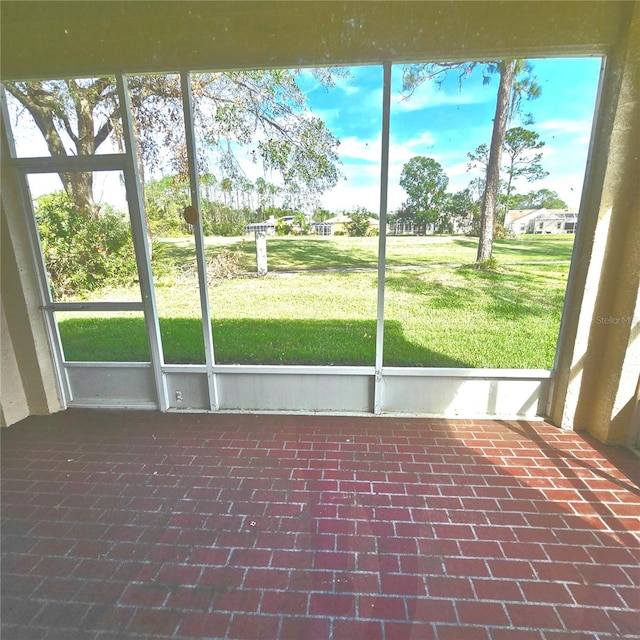 unfurnished sunroom with plenty of natural light