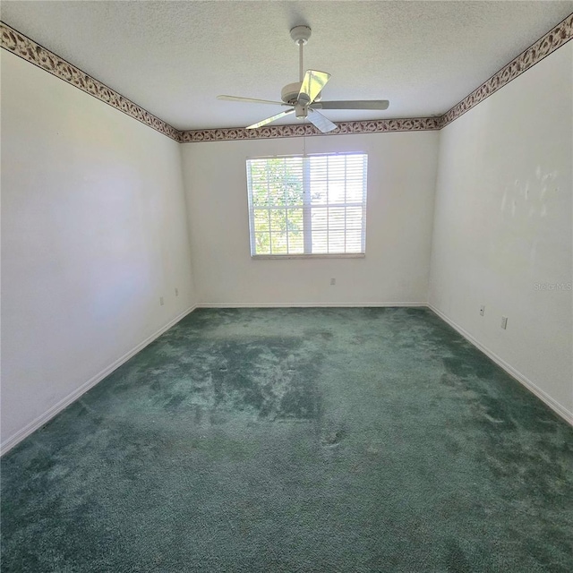 carpeted empty room featuring a textured ceiling and ceiling fan