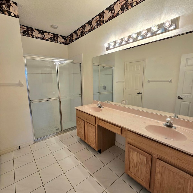 bathroom featuring vanity, tile patterned floors, and walk in shower