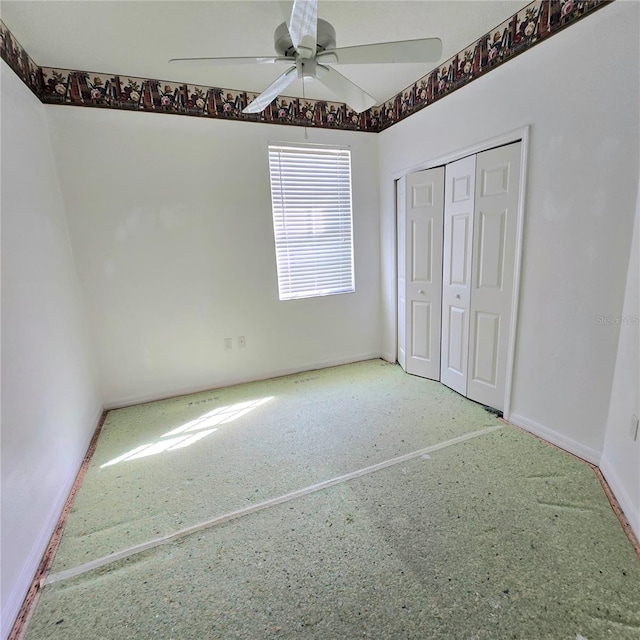 unfurnished bedroom with a closet and ceiling fan