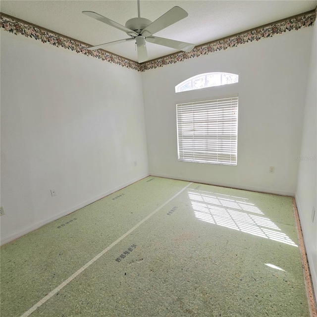 unfurnished room featuring ceiling fan