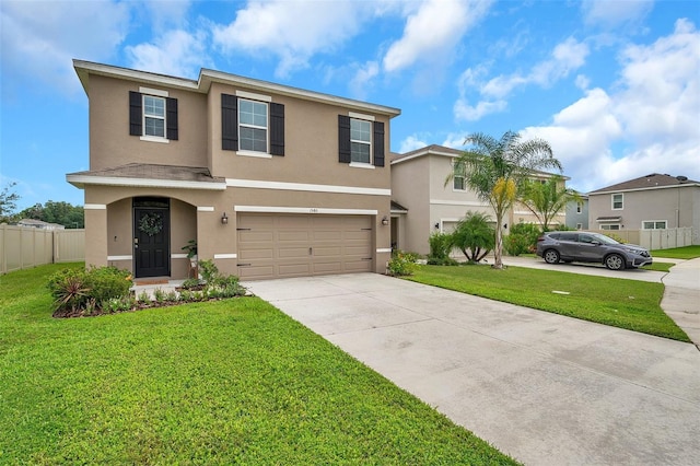 view of front facade with a front yard and a garage